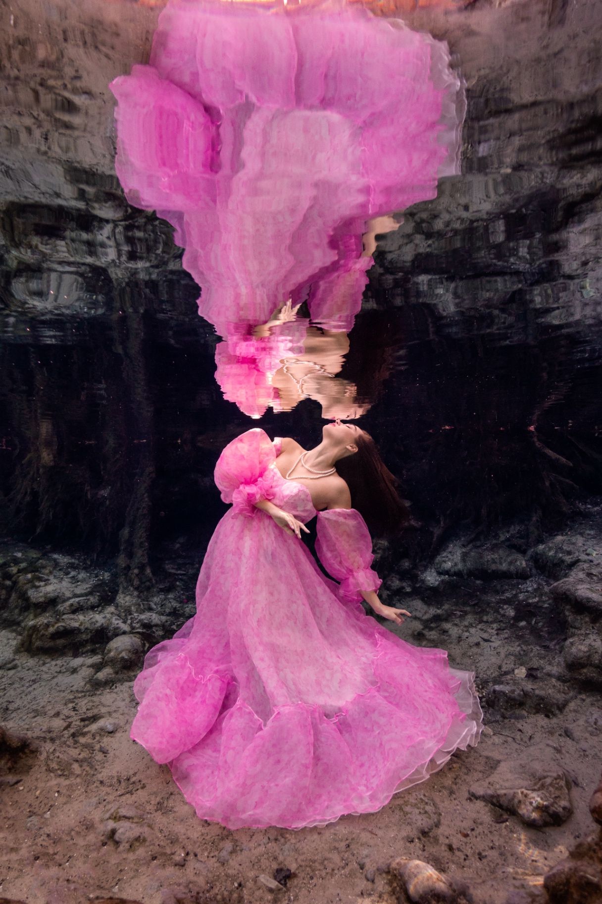 Underwater model in pink dress